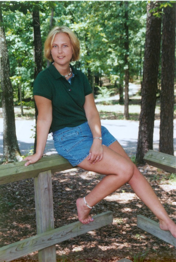sittingonwoodenfence.jpg